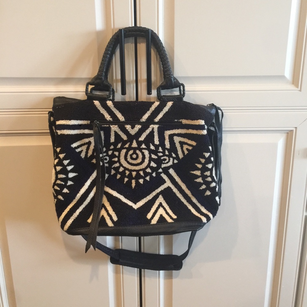 Cleobella Evil Eye weekender purse.
