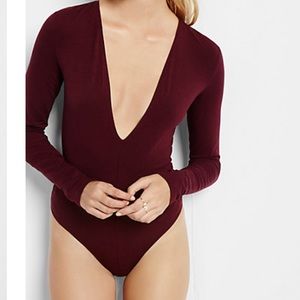 Green long sleeved one piece with long V neck