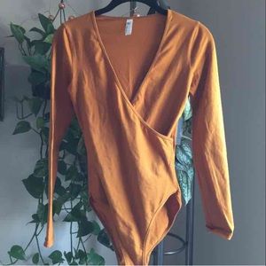 NWOT crossover bodysuit