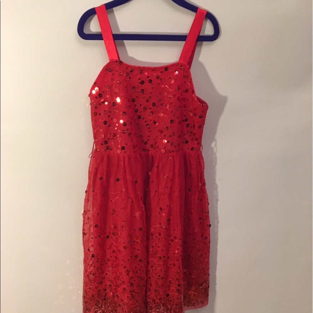 A red sparkly, formal dress.
