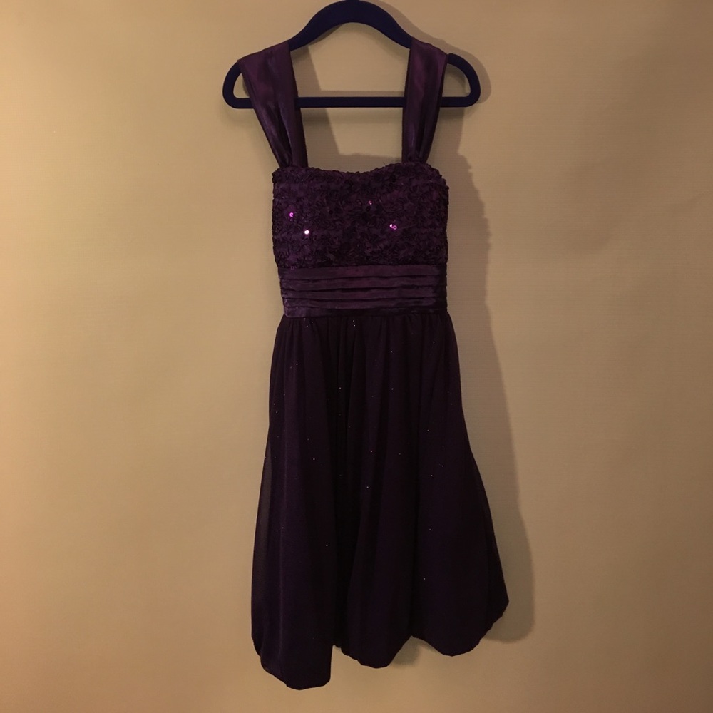 A sparkling, purple, dress.