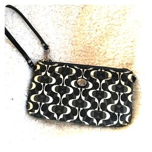 Black, White, and Grey Coach Wristlet