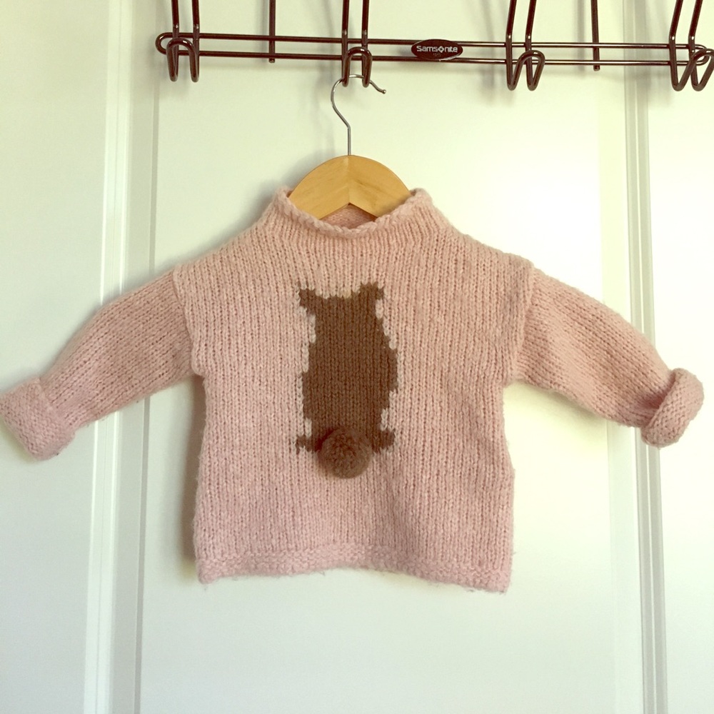 Pink sweater with bear's bottom