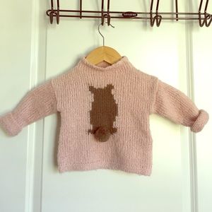 Pink sweater with bear's bottom