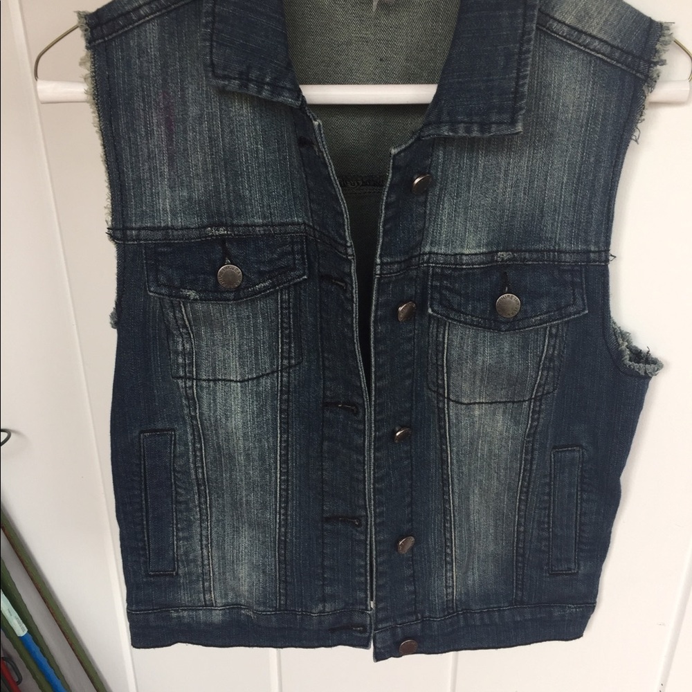 Denim vest with studded design in back