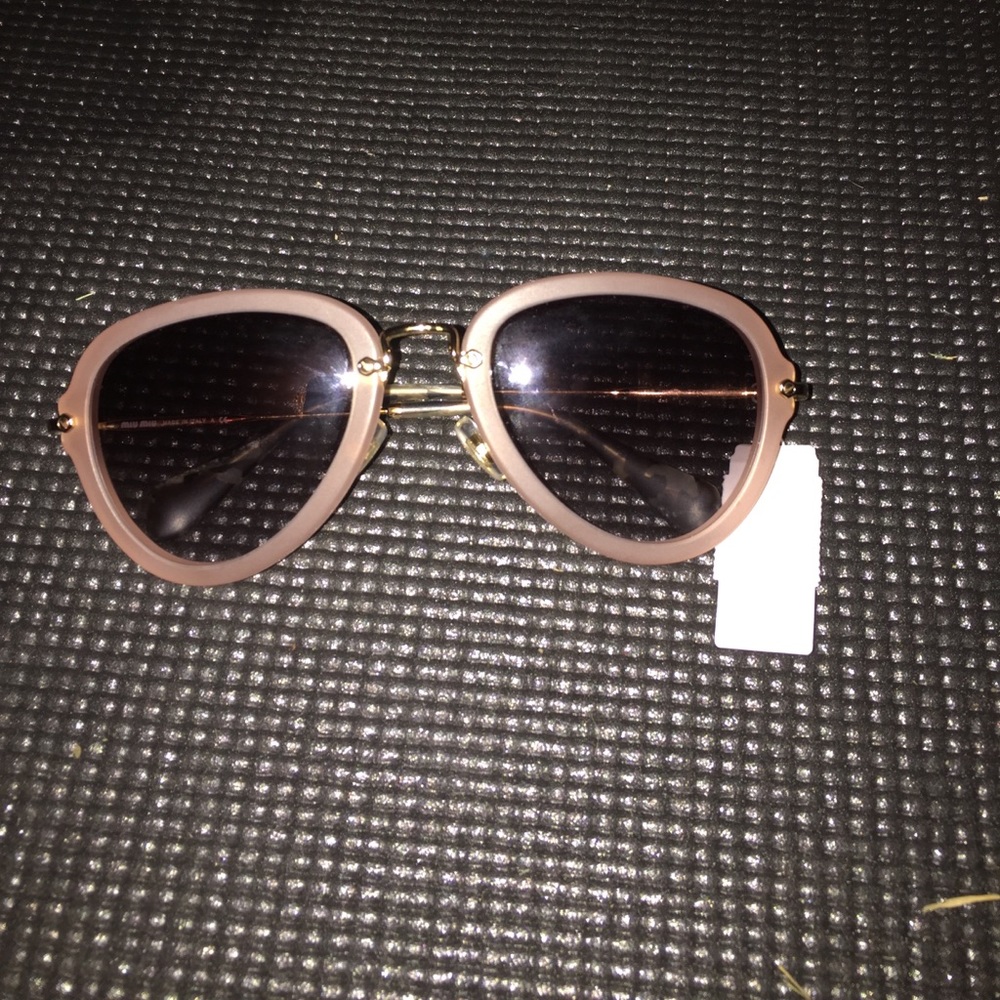 Miu Miu Sunglasses.