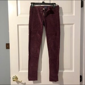 Deep burgundy wine corduroy skinny jeans.