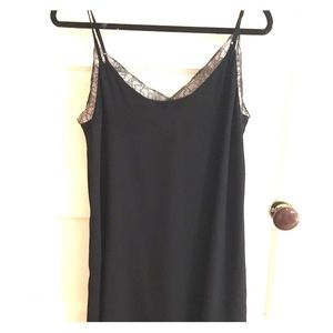 Black slip dress with pretty lace neckline.