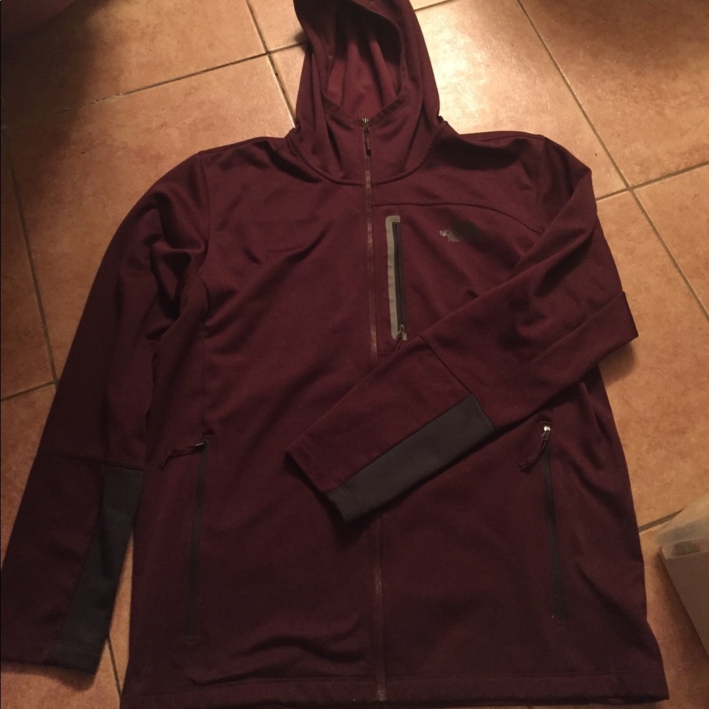 Men's light North Face jacket.
