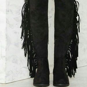 Knee high fringe boots