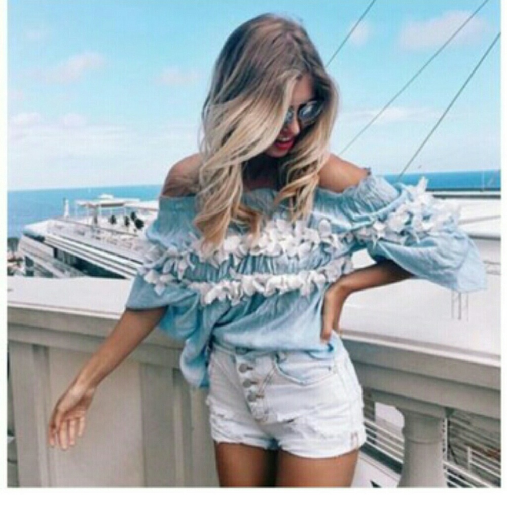 Off the shoulder blue ruffled blouse
