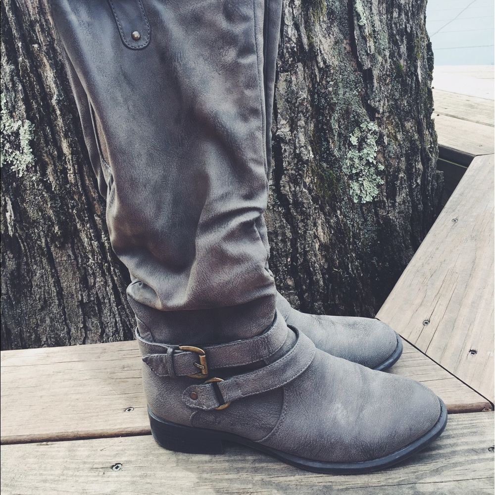 Tall buckled gray boots