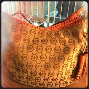 Orange MK bag with bag cover snd cleaned