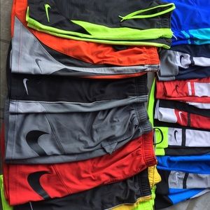 Lot of 13 pair of Nike boys shorts.