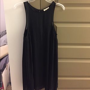 Black pleated swing dress