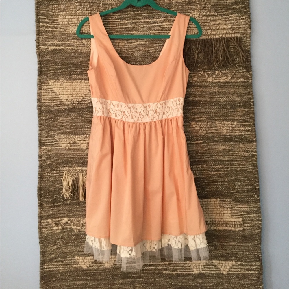Scooped back dress in blush with tulle and lace