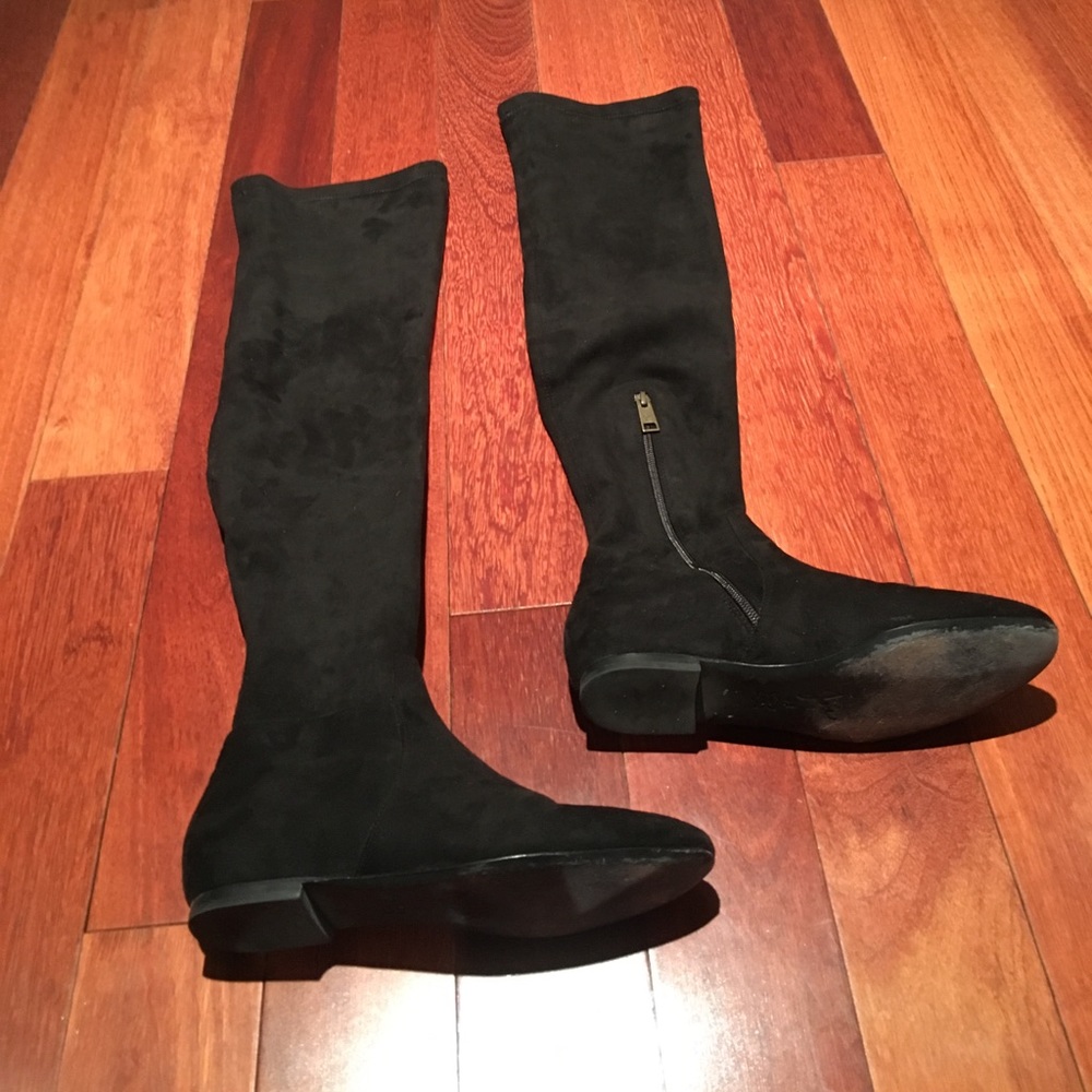 Tall stretch black flat boots with short side zip.