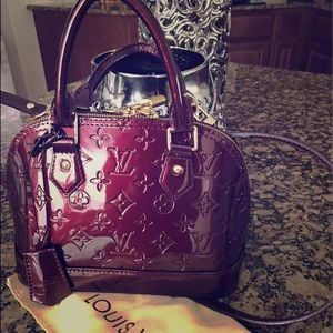 Amarante monogram Vernis Date code reads AA0123.