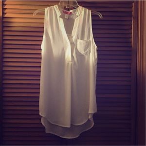 White sleeveless top.