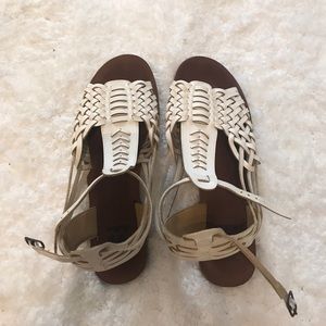 White and brown billabong sandals