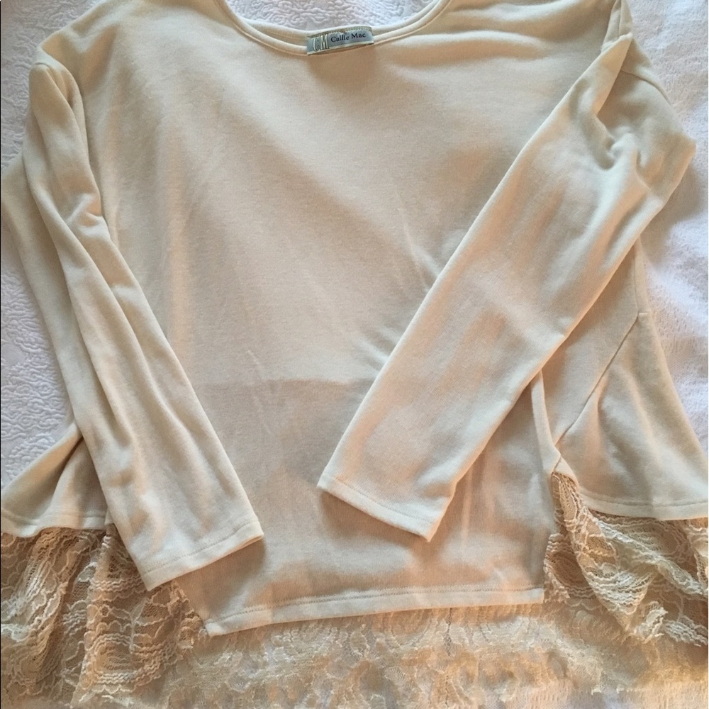 Cream top with lace peplum detail back