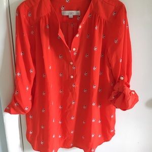An orange-red floral silky blouse from LOFT.