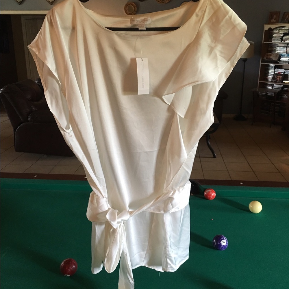 Classy white silky sheath top.