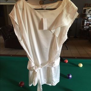 Classy white silky sheath top.