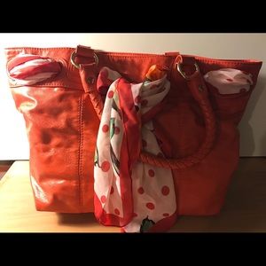 Orange leather tote with scarf