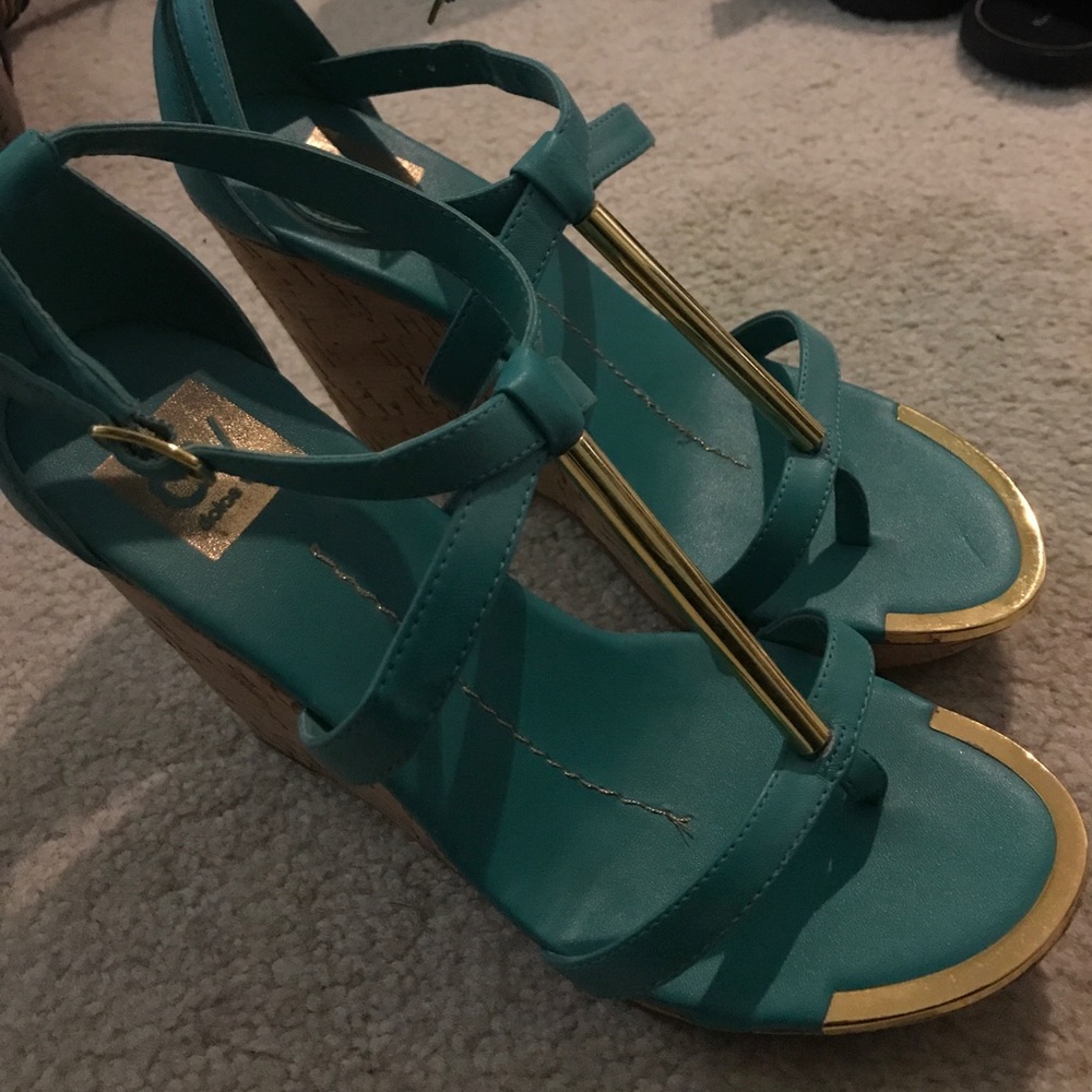 Turquoise and gold wedge heels.