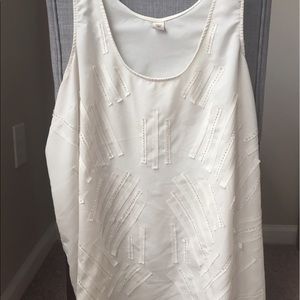 White sleeveless blouse with beading