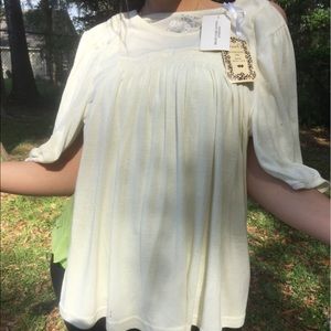 Cute light yellow ruffle shirt