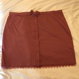 Pink button up skirt with lace accent