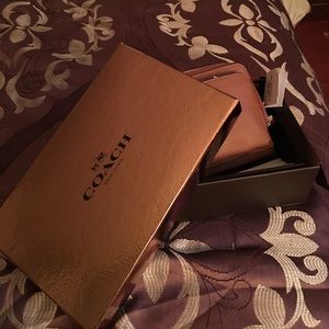 Authentic coach cell phone wallet fits I phone 6