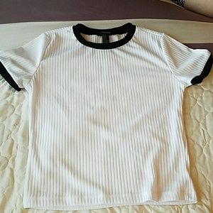 White top with black contrast trim