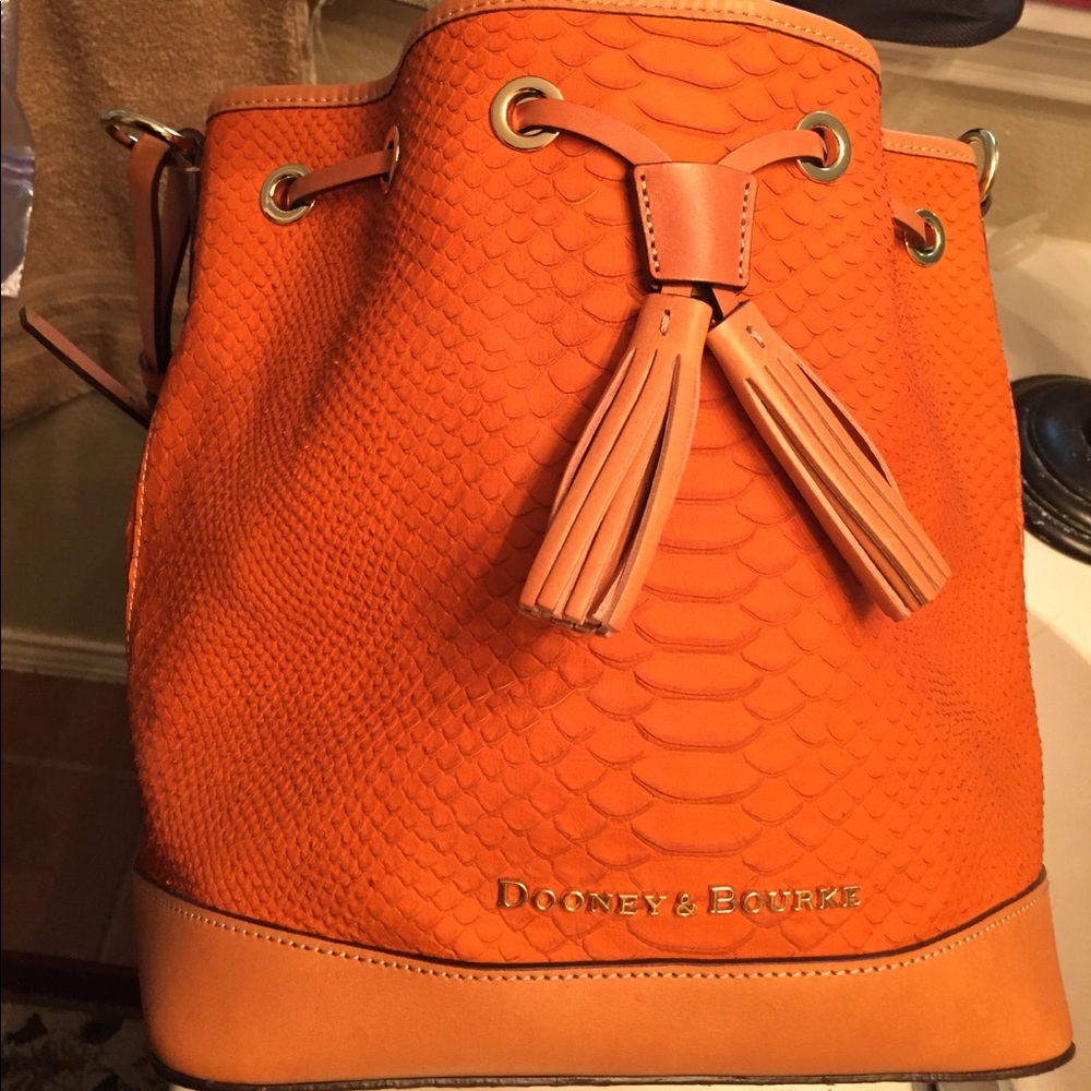 Dooney and Bourke burnt orange snakeskin bucket.
