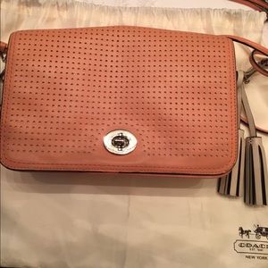 Coach crossbody purse. It's actually peach color