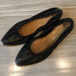 black flats with gold trim