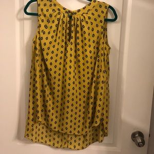 Mustard blouse with peacock looking print
