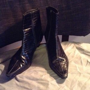 Black gator like material short boots.