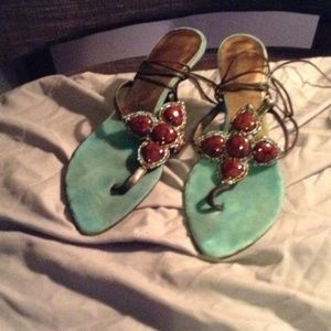 Turquoise and brown ankle tie ups.