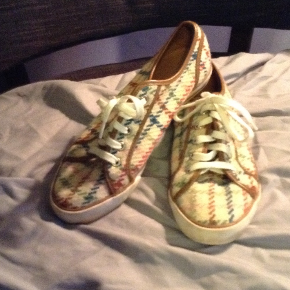 Multi color cloth tennis shoes.