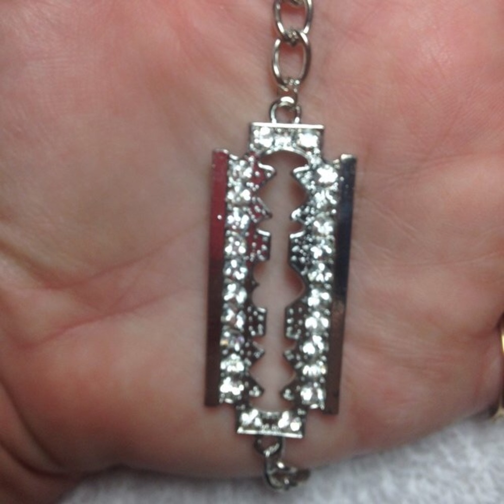 24 Crystal Encrusted Silvertone Razor bracelet