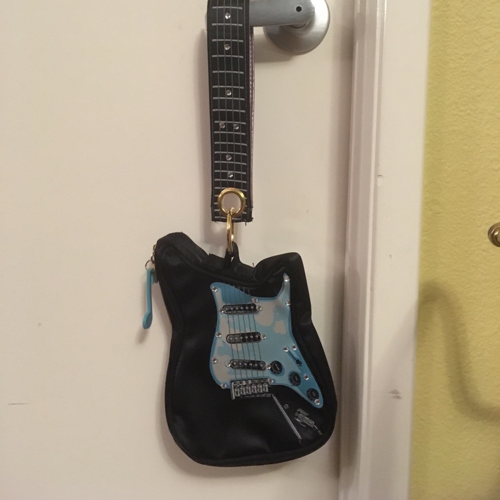 Super adorable guitar wristlet 🎸😎