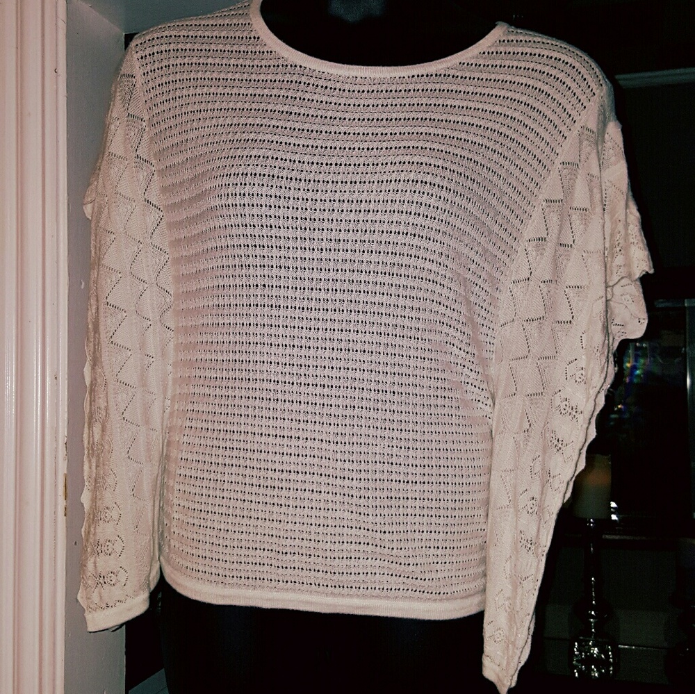 Women's boutique knitted cream blouse.