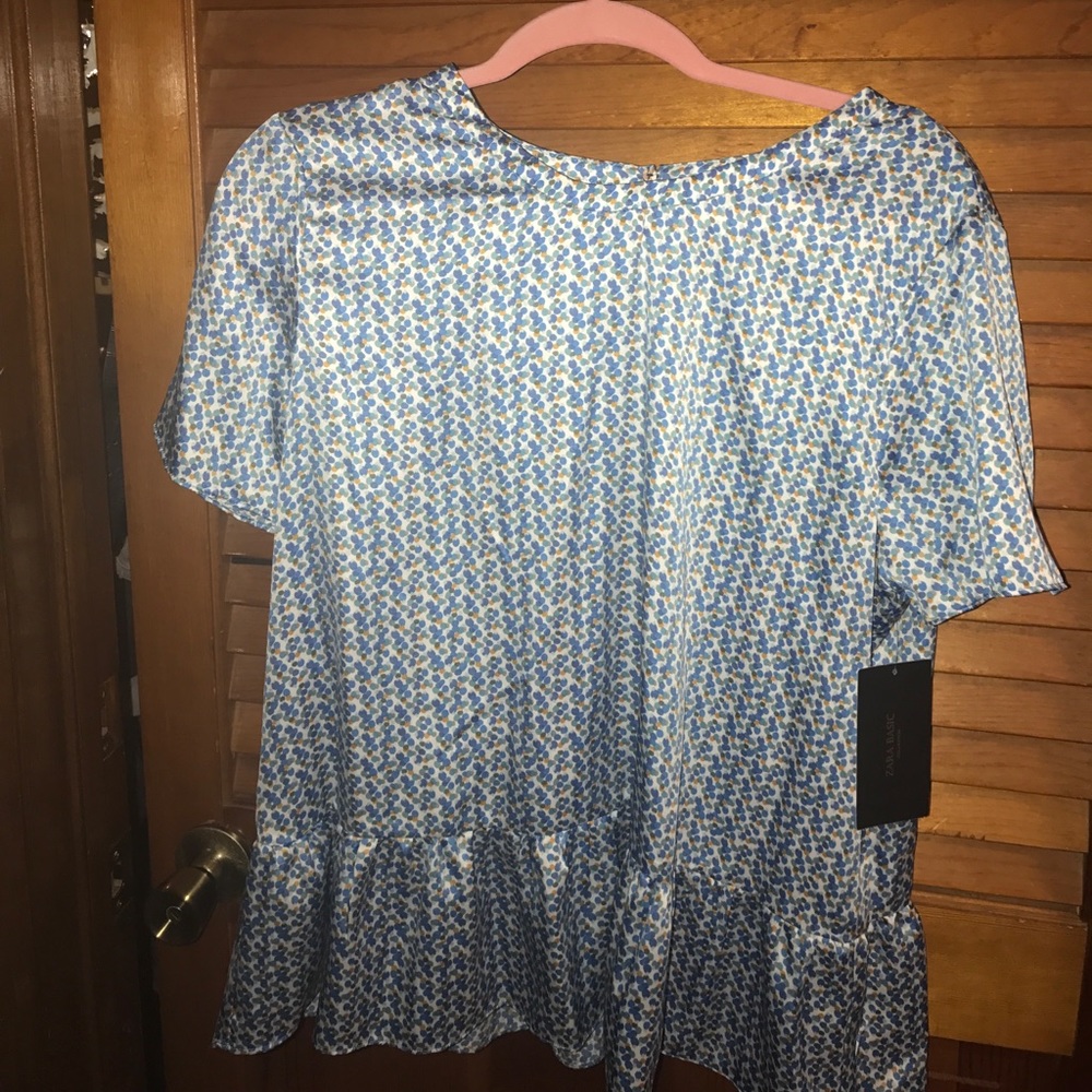 Blue polka dot silk blouse with open back slit