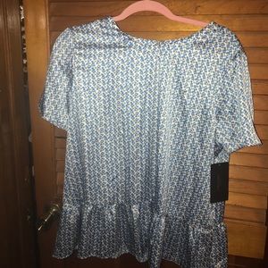 Blue polka dot silk blouse with open back slit