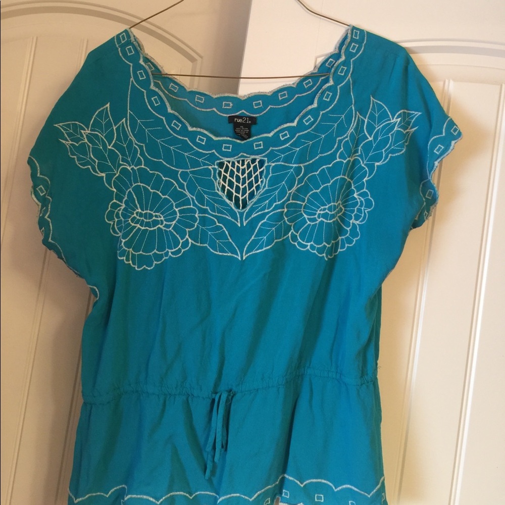 Turquoise floral top.