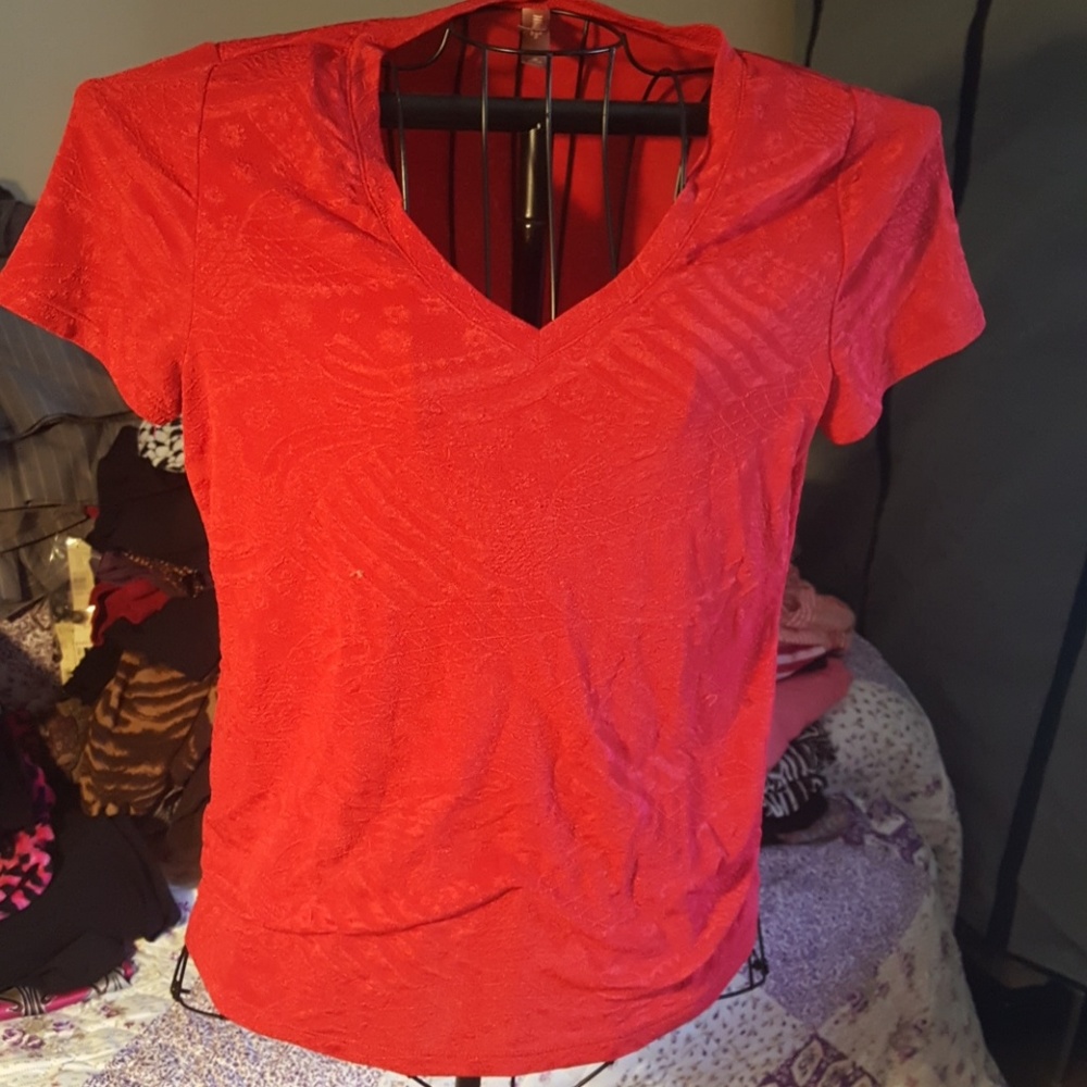 V-neck polyester top with design in fabric