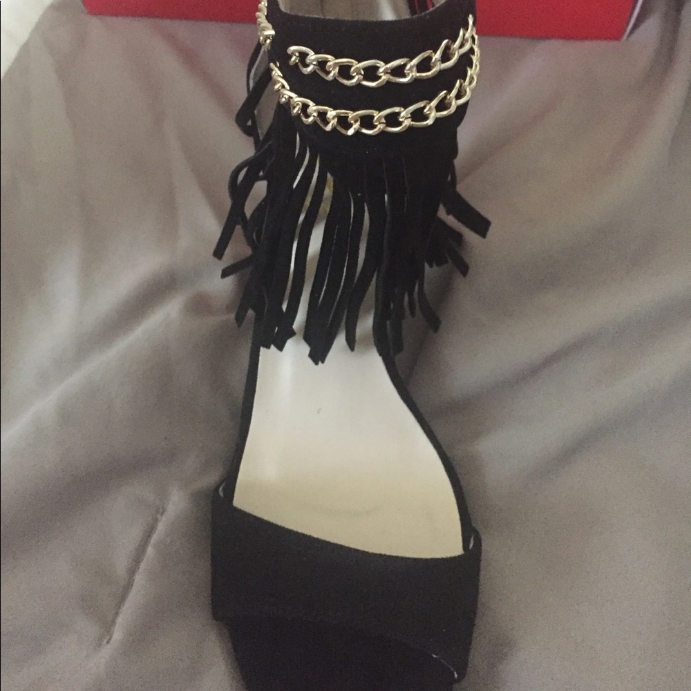 Black suede and fringe open toe shoes